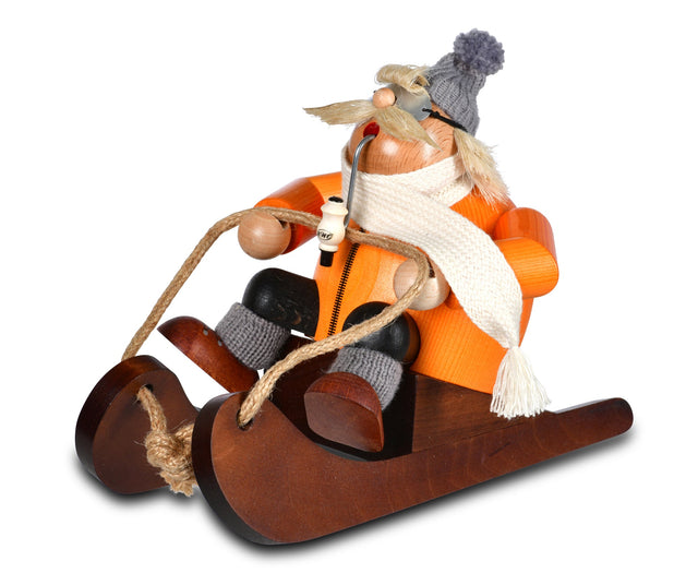 KWO - A21415 - KWO - Rökfigur Rodler Andi i orange på kälken, träkonst, 13x22x16 cm - 2025