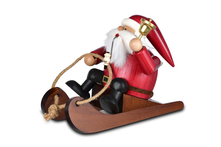 KWO - A21414 - KWO - Rökfigur Rodler Santa Claus i rött på släden, träkonst, 13x22x16 cm - 2025