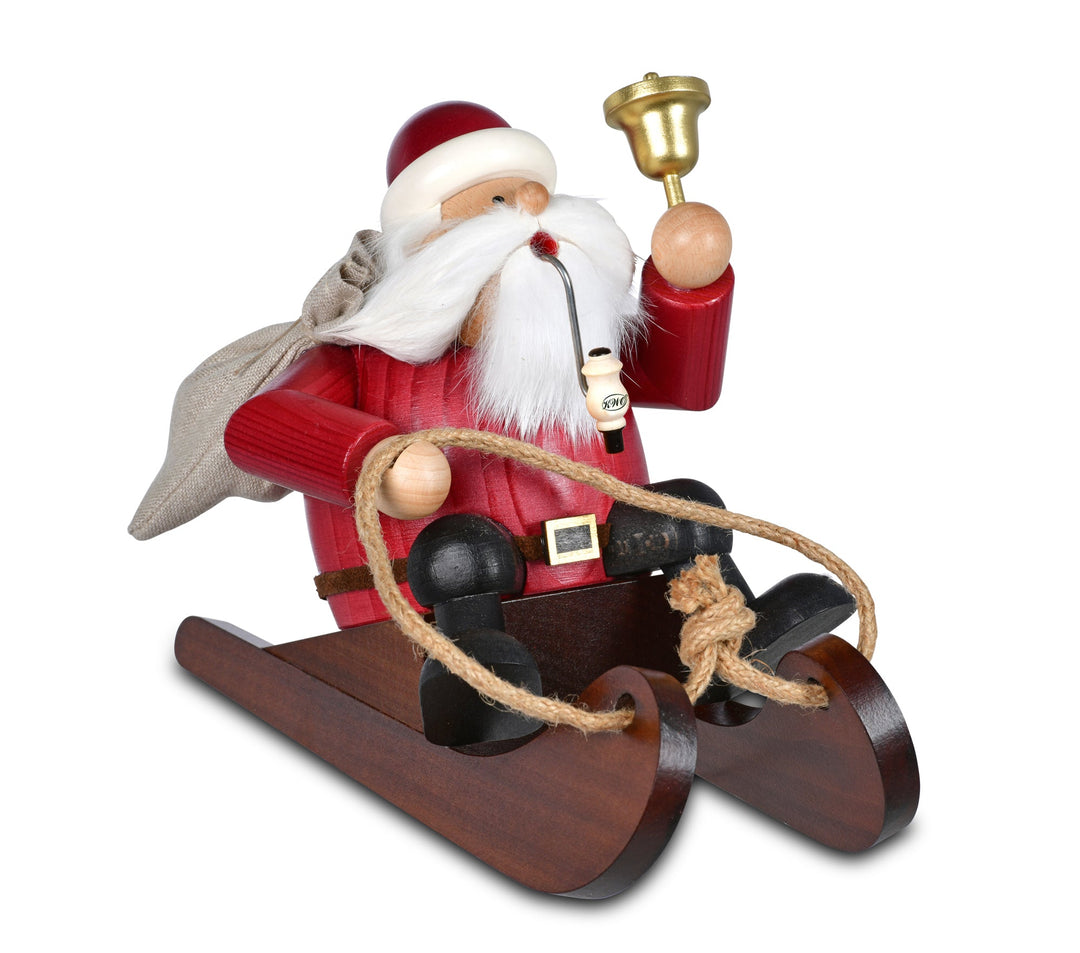 KWO - A21414 - KWO - Rökfigur Rodler Santa Claus i rött på släden, träkonst, 13x22x16 cm - 2025